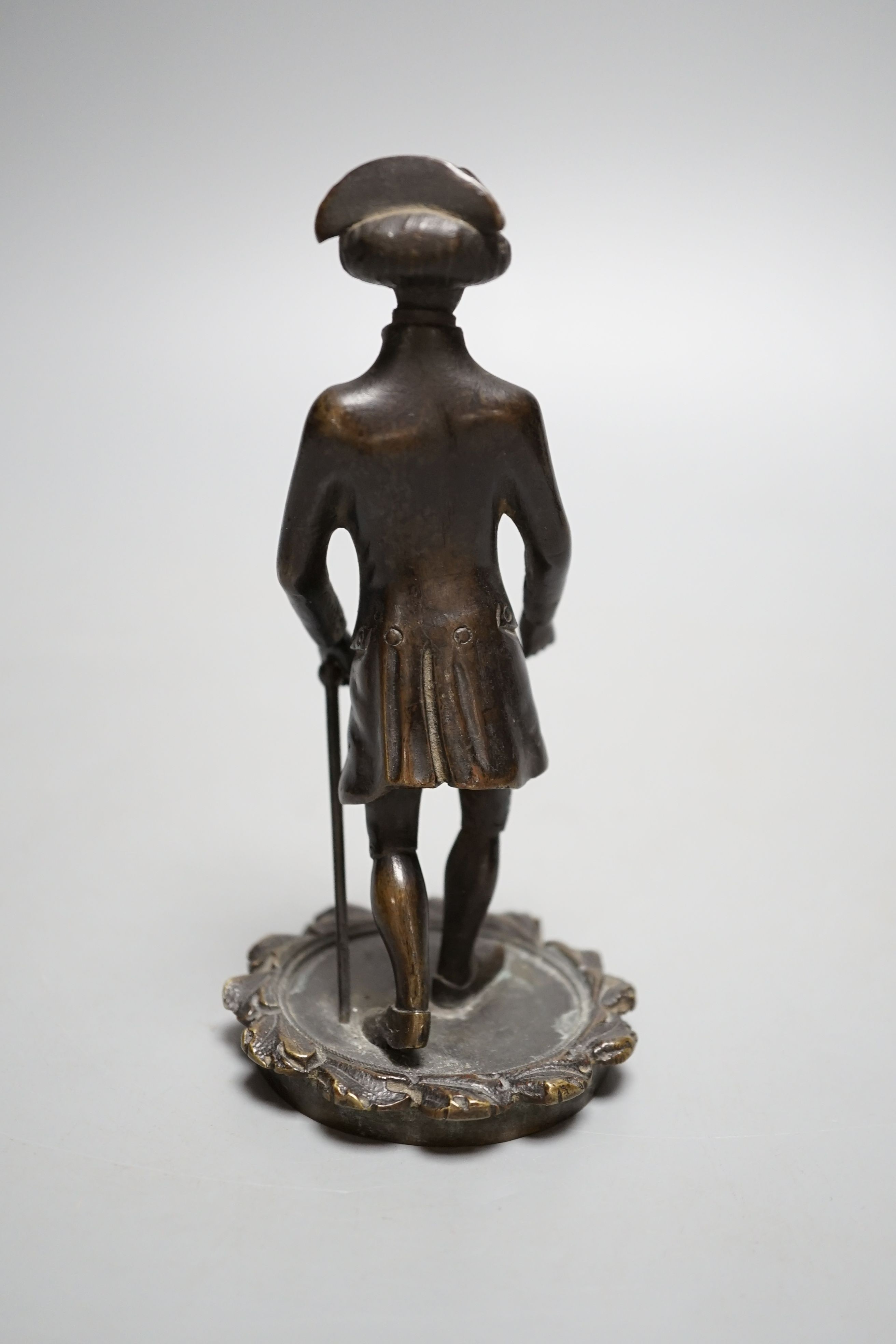 A Regency bronze tobacco box, surmounted by a figure of Dr. Syntax - 20cm tall